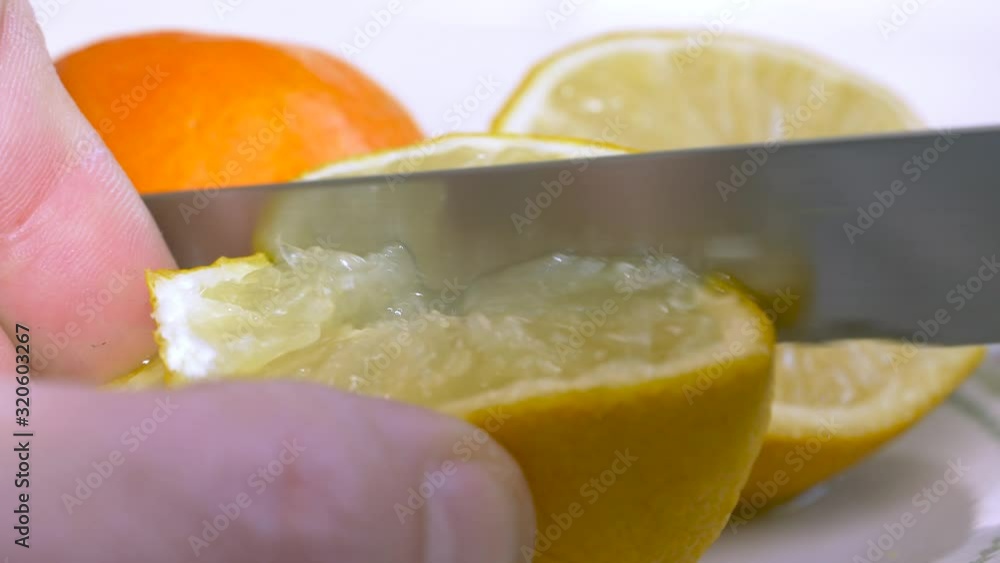 CUTTING LEMONS AND ORANGES. CITRIC FRUITS CUTTING LEMONS AND ORANGES. CITRIC FRUITS