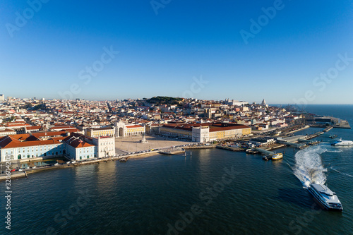 Aerial view of the skyline of the city of Lisbon with the Comercio Square, the Alfama Neighbourhood and the Tagus River, in Portugal © Tiago Fernandez