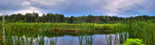 landscape panorama with lake and blue sky