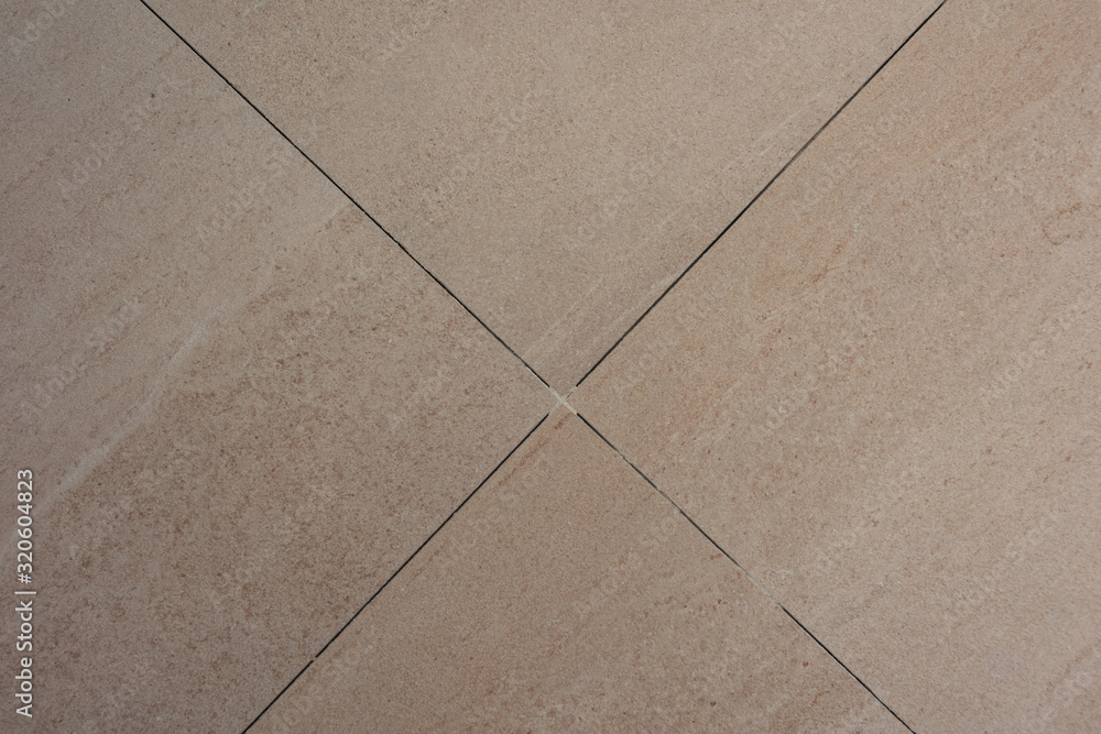 Fototapeta premium Cleaning of ceramic mosaic from dirt and dust after repair work.