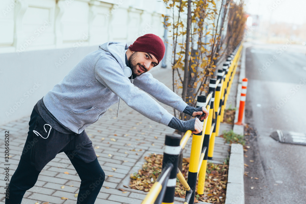 young man outdoor preparing for jogging young man outdoor preparing for jogging