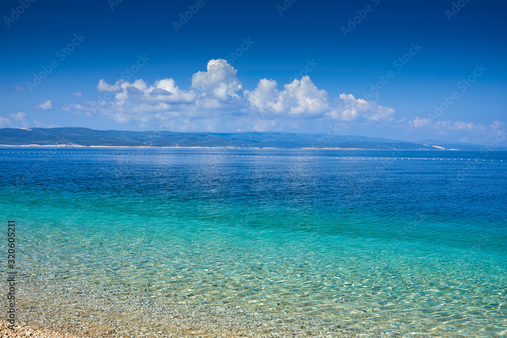 Amazing seascape of Adriatic sea. Colorful summer view of small Brela beach Croatia, Europe. Croatian coast with clear water and pine trees around. Tropical viewpoint for design postcard. Amazing seascape of Adriatic sea. Colorful summer view of small Brela beach Croatia, Europe. Croatian coast with clear water and pine trees around. Tropical viewpoint for design postcard.