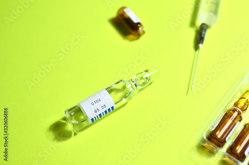 Medical syringes with a needle and injection. Anesthesia with essential and essential medicines. New rapidly spreading Coronavirus, originating in Wuhan, China
