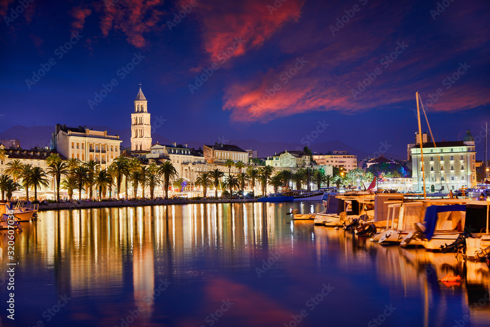 Split, Croatia. View of Split - the second largest city of Croatia at night. Shore of the Adriatic Sea and famous Palace of the Emperor Diocletian. Traveling concept. Mediterranean countries.
