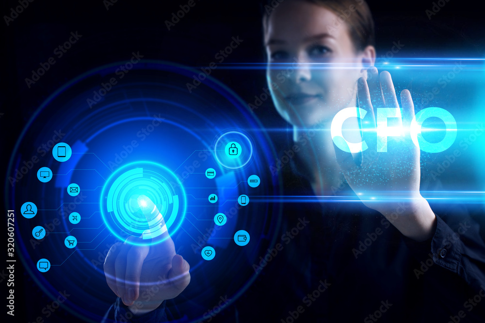 Business, Technology, Internet and network concept. Young businessman working on a virtual screen of the future and sees the inscription: CFO Business, Technology, Internet and network concept. Young businessman working on a virtual screen of the future and sees the inscription: CFO