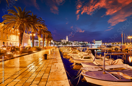 Split, Croatia. View of Split - the second largest city of Croatia at night. Shore of the Adriatic Sea and famous Palace of the Emperor Diocletian. Traveling concept. Mediterranean countries.