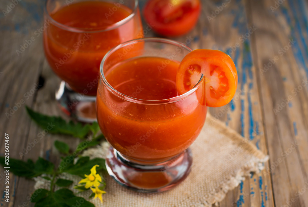 two glasses of freshly squeezed tomato juice two glasses of freshly squeezed tomato juice