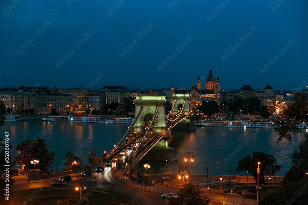 prague castle and charles bridge at night in budapest hungary