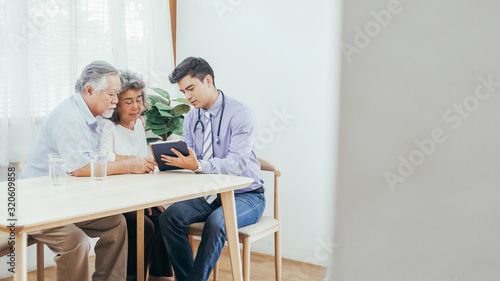 Doctor using stethoscope for auscultate Asian grandma patient while old man take care of her, service Life insurance at home, healthcare with Long live and Elderly society, Prevent epidemic concept