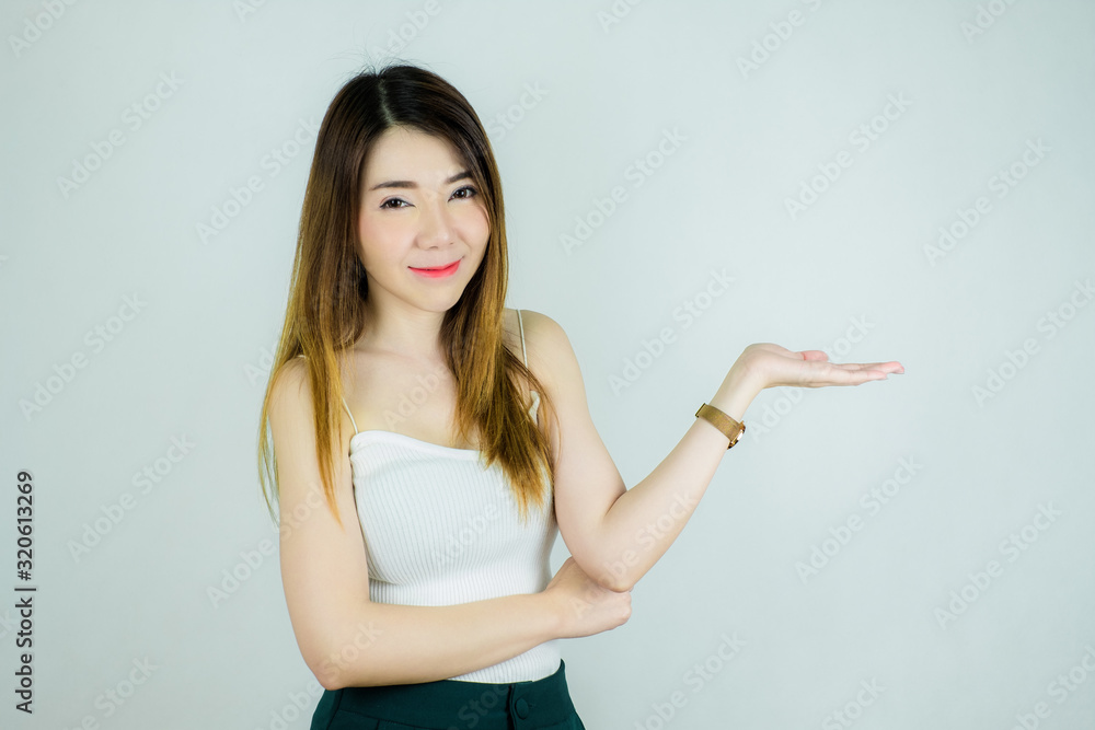 portrait of beautiful asian woman showing empty hand for display product. Copy space ready. Caucasian female model isolated on white background. portrait of beautiful asian woman showing empty hand for display product. Copy space ready. Caucasian female model isolated on white background.