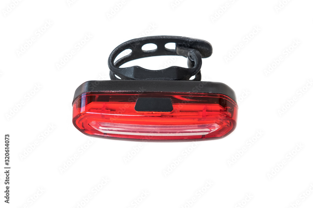 Red bicycle safe rear tail flashing back light warning lamp with flexible rubber mount isolated on white background Red bicycle safe rear tail flashing back light warning lamp with flexible rubber mount isolated on white background
