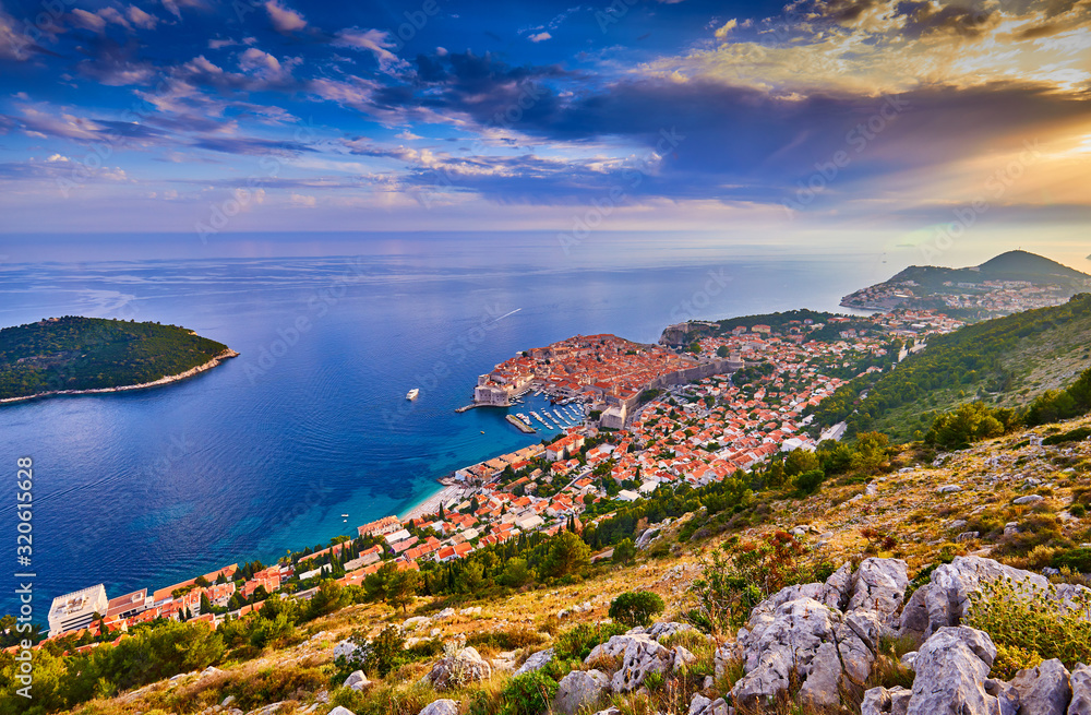 Aerial view at famous european travel destination in Croatia, Dubrovnik old town, Dalmatia, Europe. UNESCO list. Beautiful sunset view over the historic old town Fort Bokar seen in dramatic light.