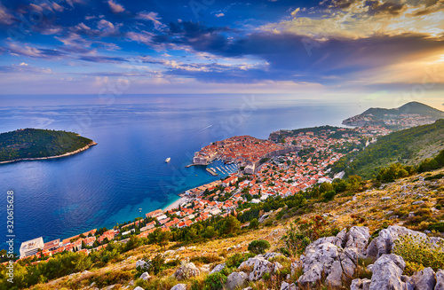 Aerial view at famous european travel destination in Croatia, Dubrovnik old town, Dalmatia, Europe. UNESCO list. Beautiful sunset view over the historic old town Fort Bokar seen in dramatic light.
