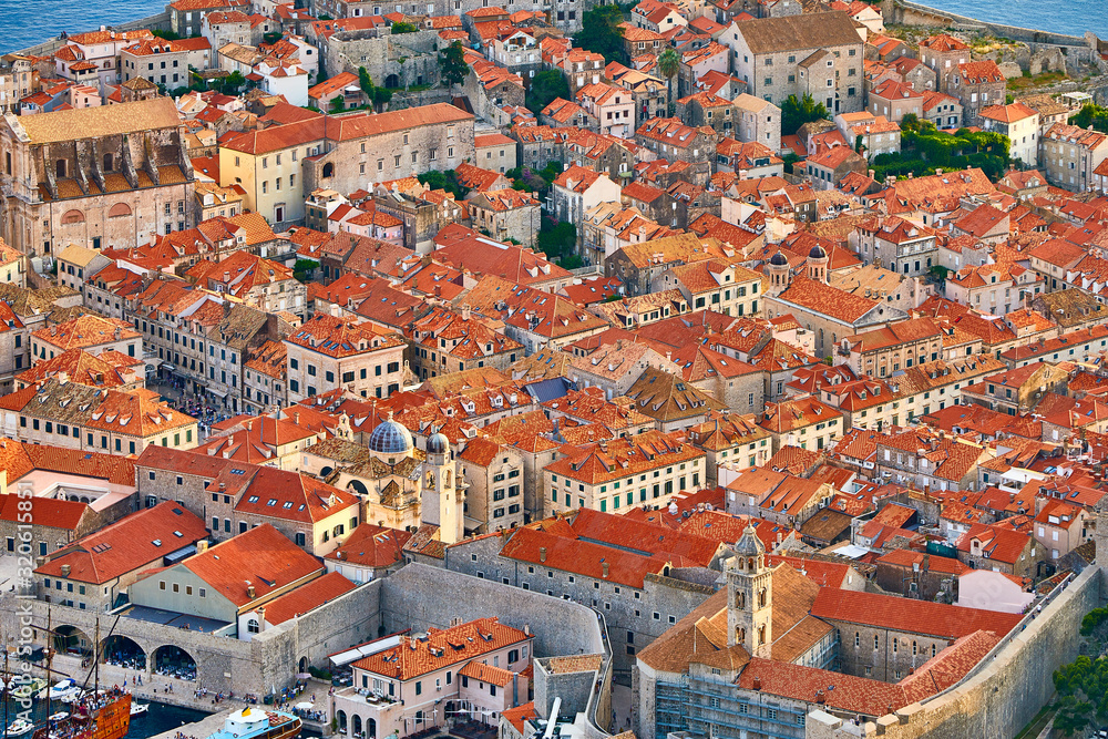 Aerial view at famous european travel destination in Croatia, Dubrovnik old town, Dalmatia, Europe. UNESCO list. Beautiful sunset view over the historic old Fort Bokar seen in dramatic light. Roofs