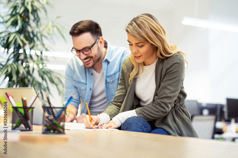 Business coworkers discussing new ideas and brainstorming in a modern office.