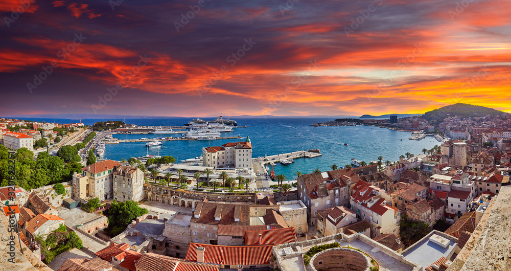 Split, Croatia. View of Split the second largest city of Croatia at dramatic sunlight. Shore of the Adriatic Sea and famous Palace of the Emperor Diocletian. Aerial view of Split coast