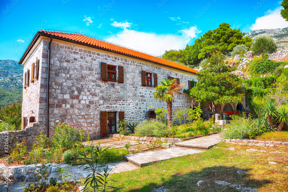 Stone church with bell tower at Gradiste monastery near Buljarica, Montenegro.