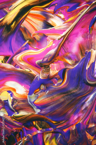 Multicolored acrylic paint flowing fluid trend bright colorful background.