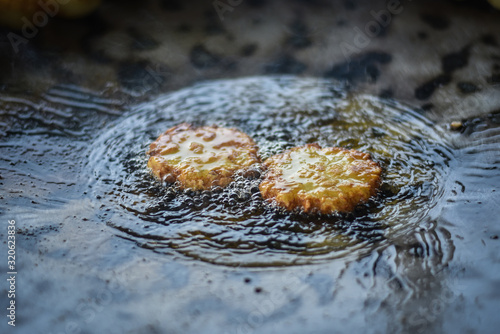 Indian cereal boiling in the oil and they selling in Indian market  Indian Tikki