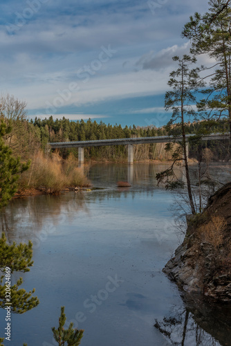 Bridge over Rimov dam with blue sky in sunny winter day
