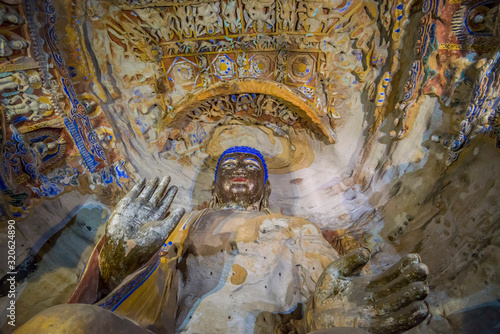 The beautiful ancient remains of Buddha Statue in Yungang Grottoes, Datong, Shanxi Province, China photo