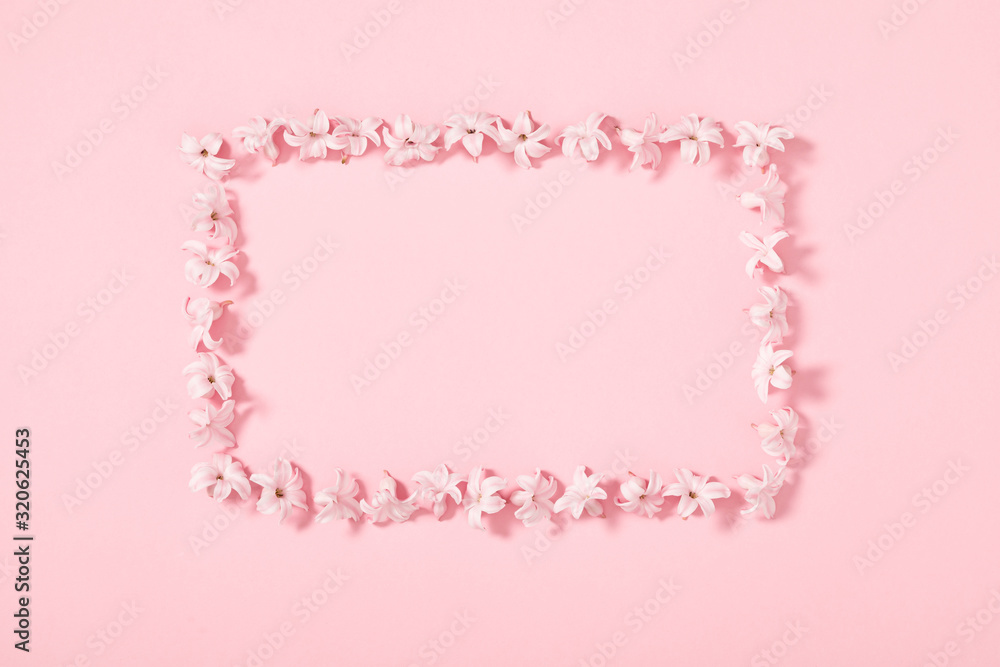 Beautiful flowers composition. Pink flowers on pastel pink background. Valentines Day, Easter, Birthday, Happy Women's Day, Mother's day. Flat lay, top view, copy space