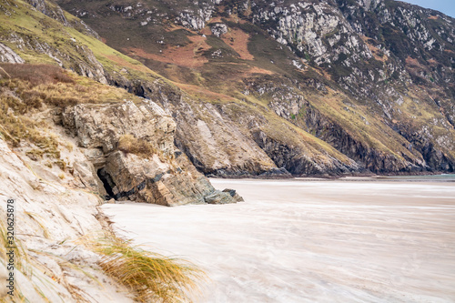 The caves and beach at Maghera Beach near Ardara, County Donegal - Ireland photo