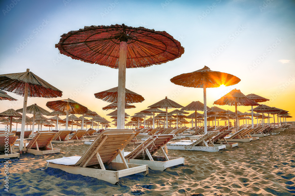 Sun umbrellas and deckchairs on the Copacabana beach, part of Great Beach (Velika Plaza) in Ulcinj
