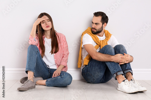 Fotografia Unhappy young couple with relationship problems indoors