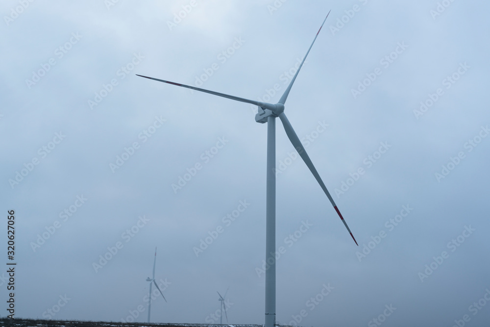 windmills in a foggy field. alternative energy. windmills in a foggy field. alternative energy.