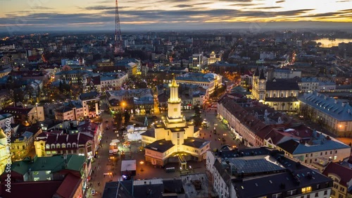Aerial sunset view of the center of Ivano Frankivsk city in the evening, Ukraine. Old historical buildings of european town. photo