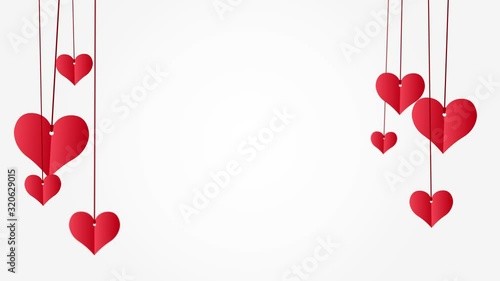 Red paper hearts hanging on red string with copy space on white background