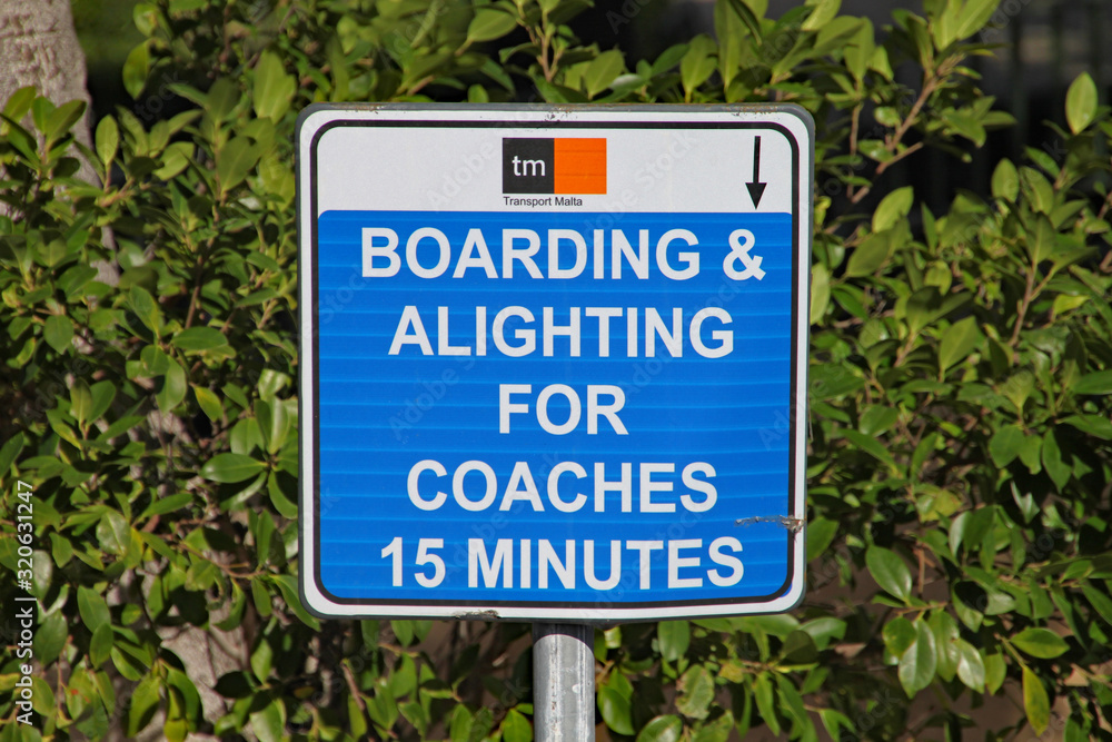 Road sign saying parking for coaches allowed for 15 minutes