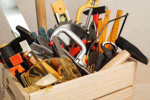 Crate with different carpenter's tools, closeup view