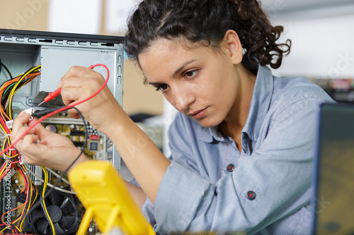 Wallpaper Mural female tecnician working on pc Torontodigital.ca