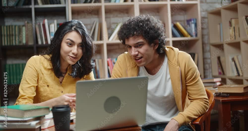 Two cheerful asian students are having a video chat with distant friend or relatives, emotionally talking and discussing something close up 4k Two cheerful asian students are having a video chat with distant friend or relatives, emotionally talking and discussing something close up 4k