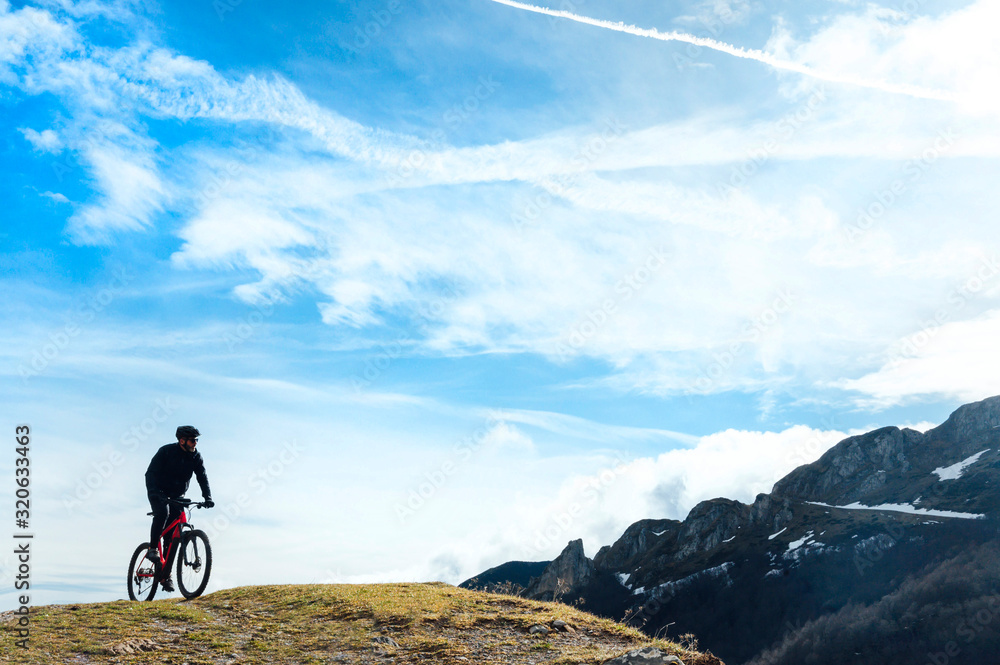 Fototapeta premium Man riding a mountain bike