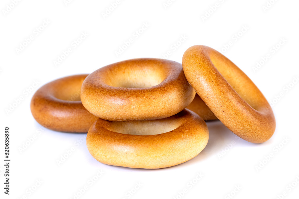 Small dry bagels, small rolls on a white background Small dry bagels, small rolls on a white background