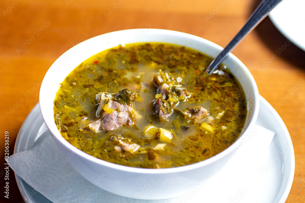 chakapuli, meat and greens soup in white plate, georgian traditional food chakapuli, meat and greens soup in white plate, georgian traditional food