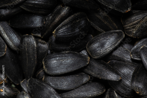Fotografie black sunflower seeds, close-up, backgrounds and textures.