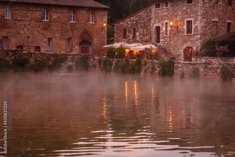 Thermal pool in the old town in Tuscany. Travel destination Tuscany, Italy