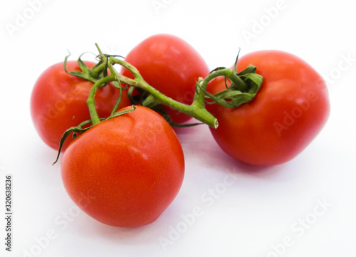 fresh tomatoes isolated on white background