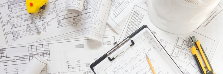 architect design working drawing sketch plans blueprints and making architectural construction model in architect studio,flat lay