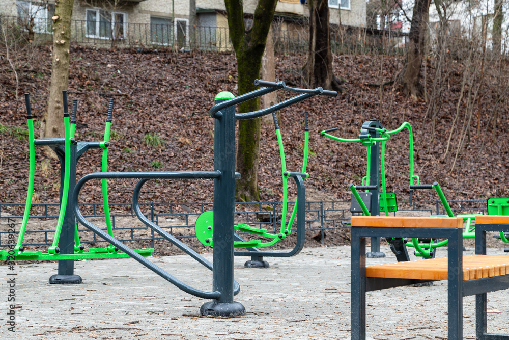 Equipment for free street fitness, near the park. A good addition to the walk. Healthy lifestyle Equipment for free street fitness, near the park. A good addition to the walk. Healthy lifestyle