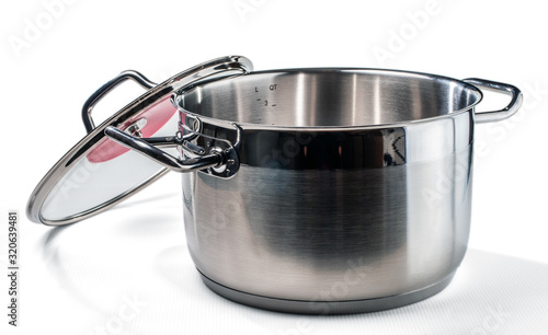 Stainless steel pan with the with glass cover removed. Isolated on white background.