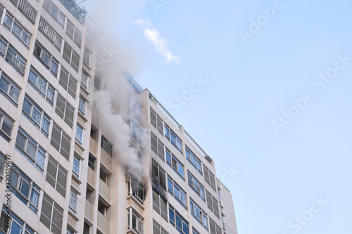 Fire in the building, smoke coming from the apartment of the building
