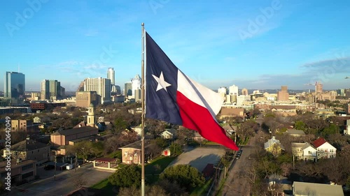 4K Texas Flag Austin Texas Skyline Drone View Orbit Slow Motion photo