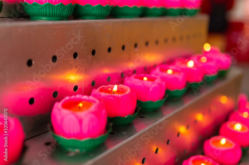 Photography Icon lamps in a Chinese temple left by visitors during prayer.