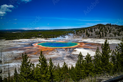 The grand prismatic geyser with colorful mineral and algae deposits seen from above in Yellowstone National Park Wyoming USA
