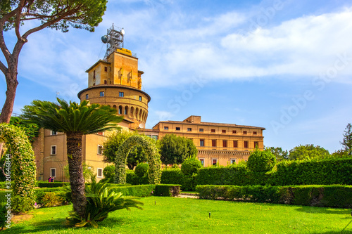 Rome, Vatican City, Italy - Alleys of French Garden section of the Vatican Gardens in the Vatican City State with Vatican Radio broadcasting tower in the background